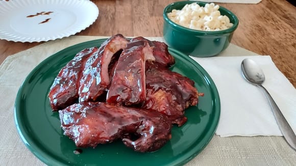 Picked up a couple full racks of pre-cooked pork ribs at Sam's for dinner.  They are fresh grilled on their in-house rotisserie grill each day, just reheat and serve, so easy, and they're very, very, tasty.  Wife made white cheddar mac and cheese as a side.  I'm absolutely stuffed!