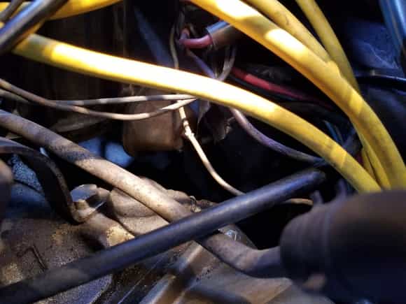wire from Voltage was crimped under the distributor cap. New voltage reg. new alternator, newer battery,,12.6 on the meter.  Still not charging?   My next fix is this wire...Whats your thoughts this being the culprit?  Thanks, Jack