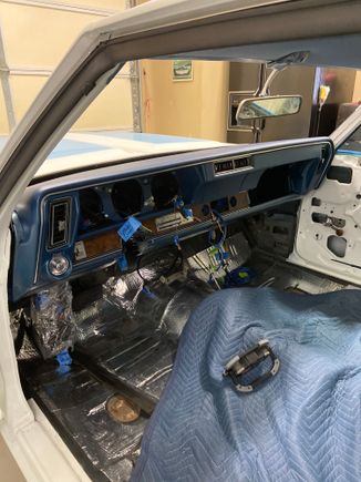 Dash in place. Glovebox door, lower ac ducts, gauges, radio and steering column next. 