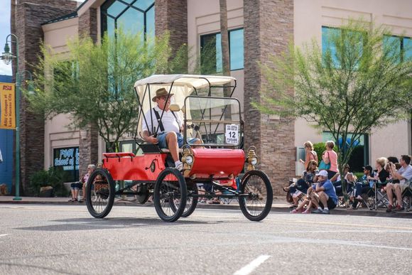 Leading Antique Cars in a Parade