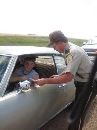 i got pulled over :(  i didnt get a ticket :)