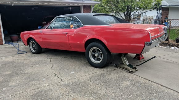 This is what my 67 looks like with the air shocks lifting the rear (ignore the jack, I was getting ready to take off the shocks). Unfortunately the car sits lopsided without any shocks so I think one of the springs is weak.