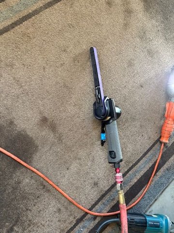 My prime tool for spot weld removal.  Ingersol Rand 1/2” wide by 18” long air belt file.  Nose is about 5/8” diameter or so.  I’m running an 80 grit belt.  This thing works awesome.  Takes about 5 seconds to grind through top layer.  