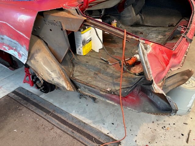 As much as I wanted to remove the QP in one piece, I could see that it would make this touchy area go better if I hacked off the rear half of the panel, so I did so.