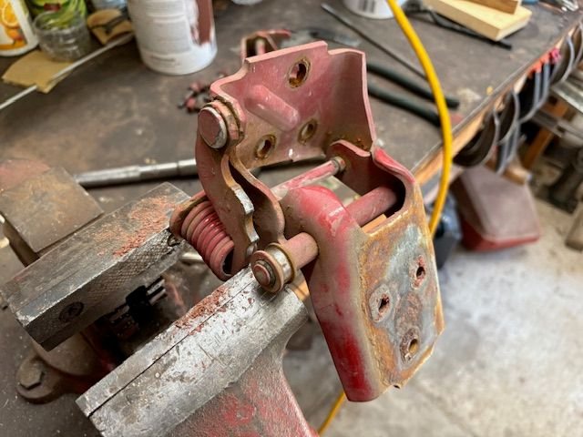 The detention spring can be compressed in a vise, gradually releasing the tension 