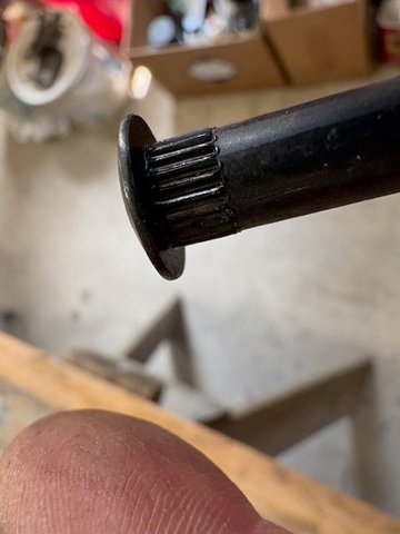 The new hinge pins are knurled.  The knurling is just a little bit longer than it should be.  If totally driven home, the knurling gets into the bushing, just a little.