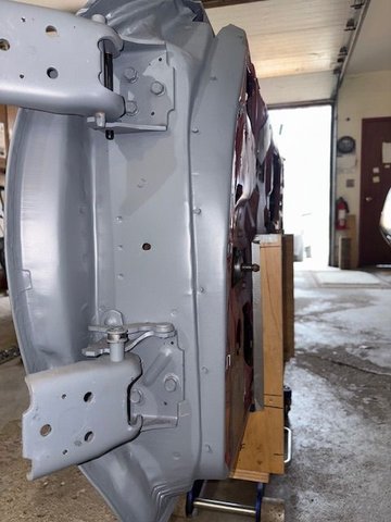 I decided to also put two holes in the door leafs of the hinge.  So I can attach hinge to either the door or car body first.