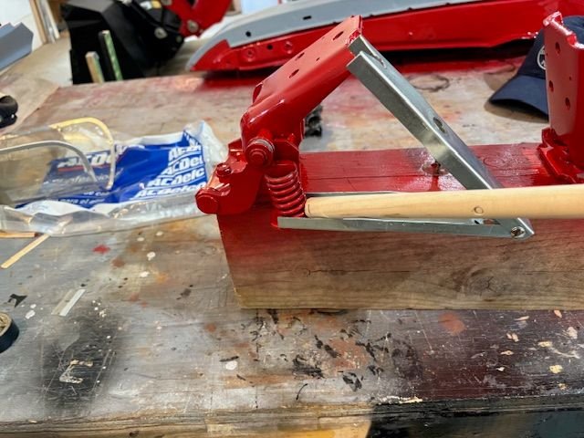So the bottom jaw of the tool is pinched between the spring mount and spring.  I took a wood dowel and drove the spring off of the tool.