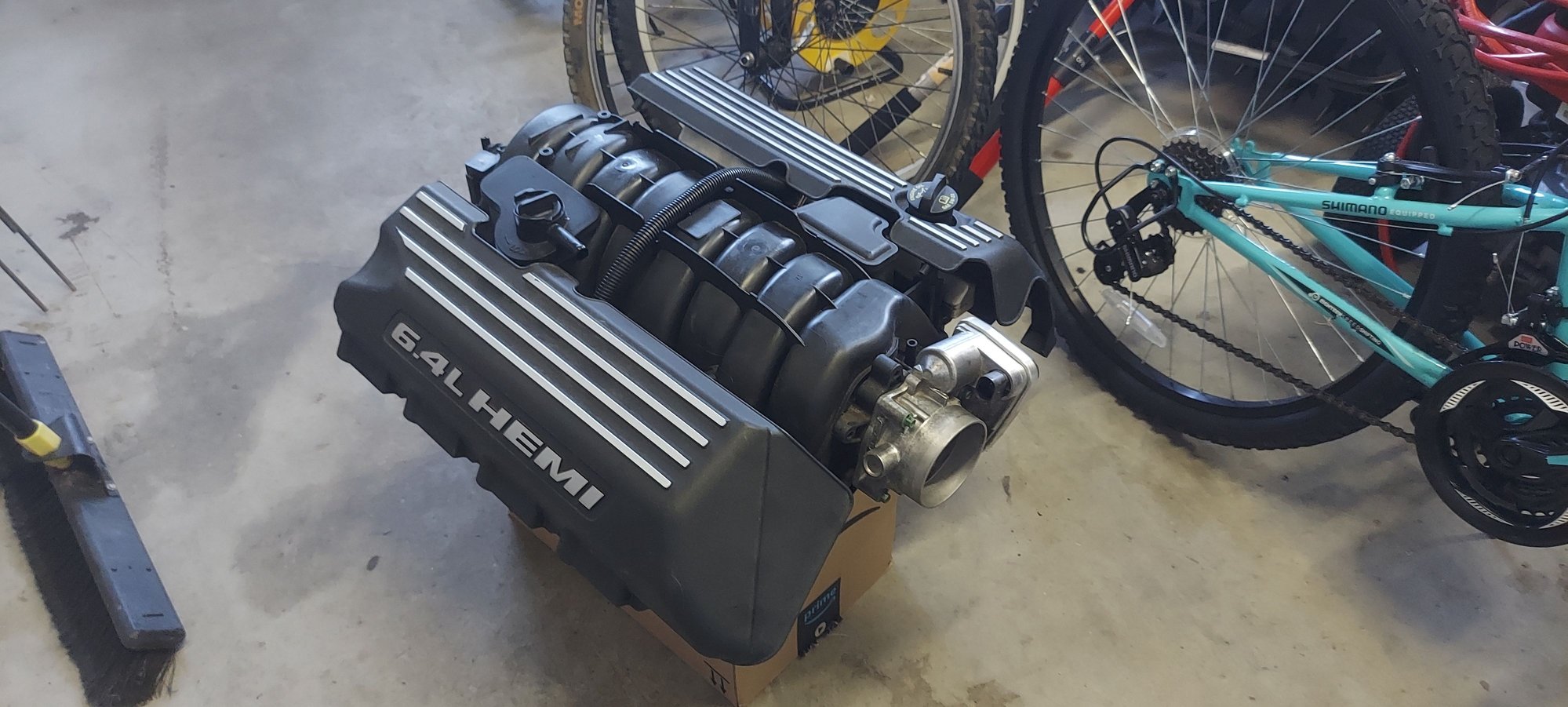 6.4L valve covers do fit but require some modifications to the fuel and vac lines.  I am painting the valve covers silver but will leave the block BGE black.