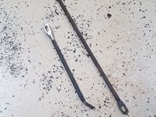 The rods. Short is modified, long is factory.