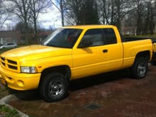 This One. 3rd Ram Solar Yellow '99, 5.2L, Club Cab Sport, Auto 2x4. Second Day I Owned It Was Totaled. :(
