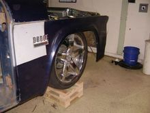 The wheels are tucked about 3-4 inches in. I like it, but it may have to come out more. 