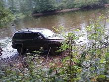 Taking a bath in the river.