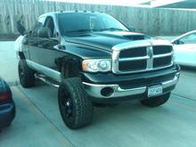 Definately need to get the fender flares installed, and the grille on the hood installed... oh yeah and the Road Armor bumpers sitting in the back of the truck on.