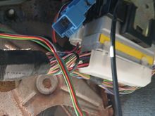 They are under the dash just left of the steering column...