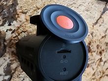 Magnetic tethered side power and emergency save button which moves aside to reveal TF slot, reset button, and power/save buttons