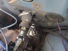 That's the top U joint on my intermediate shaft.  The purple wire through the grommet is for my subwoofer.