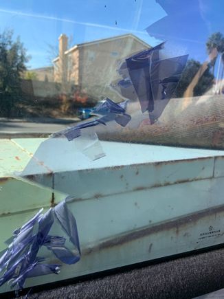 Old tint being stripped off.