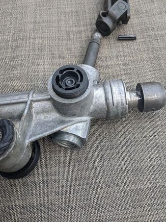 My covers use pin slots, but I didn't have one of the right size so I just drilled it out to accept the largest size pin wrench that would fit. I did need to use a breaker bar on the metal cap to get it free. Note that these caps may be staked as well (mine were) so be sure to unstake them if they are. 