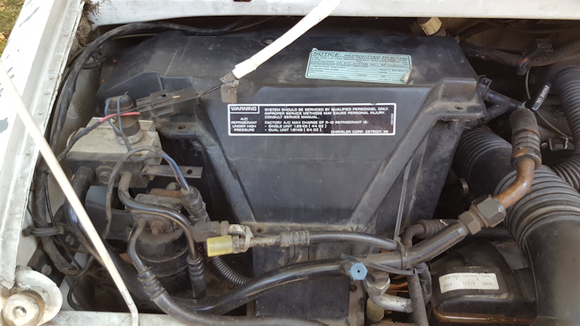 The box with the A/C ...note the rear A/C lines are cut off and sealed