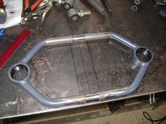 Both a-arms cut, and fit. The sharpie marks were laid out before, so you can see they are longer now. 