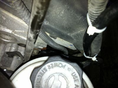 Here's the new engine ground.  15mm bolt behind the power steering resivoir.