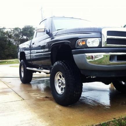 My new 5.9! Painted it myself. dual xilator turbo mufflers, No cats, spectre cold air, Gibson stainless steel headers, 50mm throttle body spacer, hughes plenum, 35 inch terra grapplers, 16 inch mickey Thompson classic III polished rims. I love my truck!