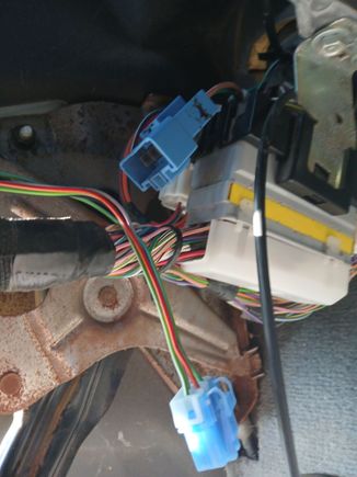 They are under the dash just left of the steering column...