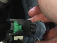 Insert your new sensor and push it in firmly. Press the green tab back into its original position until it clicks. The new sensor should be locked in now. 