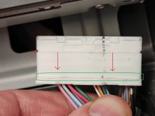 I think I unlock by pulling down the green-circled handle.