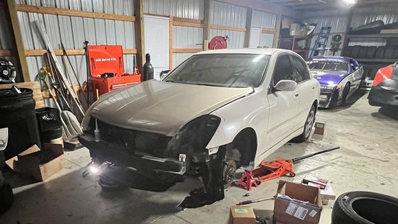 Right before the initial tear down, where we removed the mismatched hood for easy access LOL