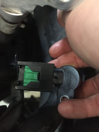 Insert your new sensor and push it in firmly. Press the green tab back into its original position until it clicks. The new sensor should be locked in now. 