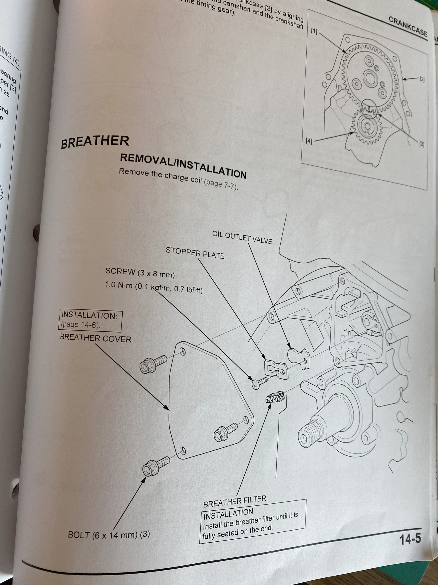 Breather system in the crankcase. It doesn't show if the Diaphragm tube actually comes out of this.