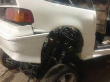 after torching the subframe and putting out multiple fires due to the amounts of expanding foam in the car we lifted the body over the subframe with a come along and ratchet strap from the ceiling.