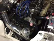 Updated pic of the engine bay. New skunk hoses and the manifolds in. Car runs pretty good so far 