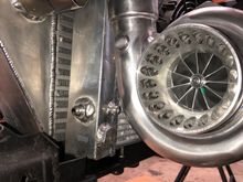 This turbo is about an inch shorter side to side. Witch unfortunately made it impossible to keep my backdoor intercooler setup on the hot side. 