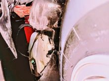 The damage done to the driver's inner fender.