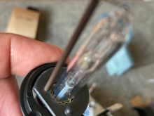 Bulb w/ horseshoe clip. Not the recess that aligns w/ the dimple.