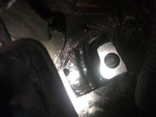 Big washer resting on what remains of the top of that bracket thing the nut was welded on.