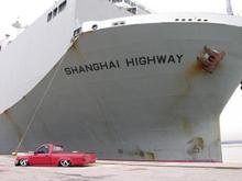 My truck in front of a car ship at work