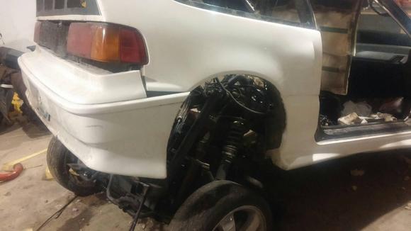 after torching the subframe and putting out multiple fires due to the amounts of expanding foam in the car we lifted the body over the subframe with a come along and ratchet strap from the ceiling.