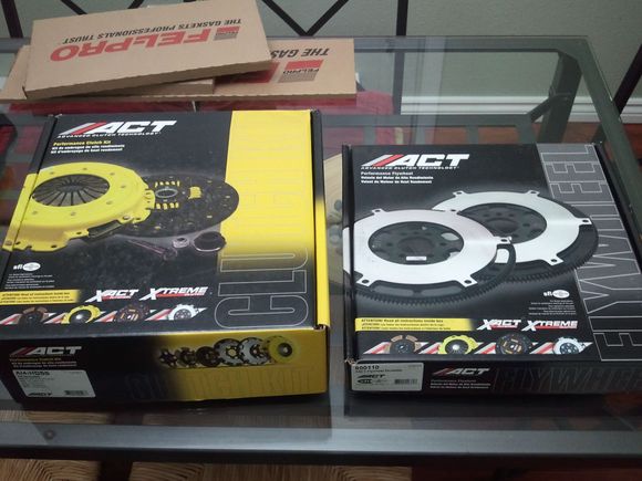 I worked side jobs and sold parts to pay for these. ACT clutch and lightened flywheel.