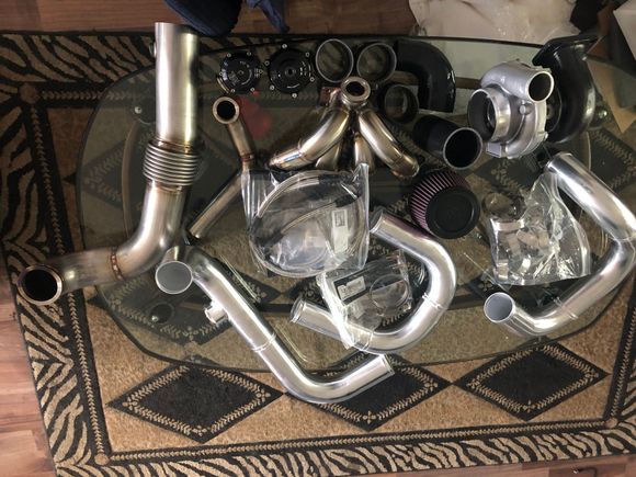 Here’s most of the turbo kit. Never having turbo’d, my head is almost spinning looking at all of it. Haha. I know once I’m done it’ll all seem simple. Intercooler is coming in the another package tomorrow. I opened it, and I’m pretty sure I’ve been sitting here for 2 hours staring at and playing with it. Need to put it away and go make that money. Ha. 