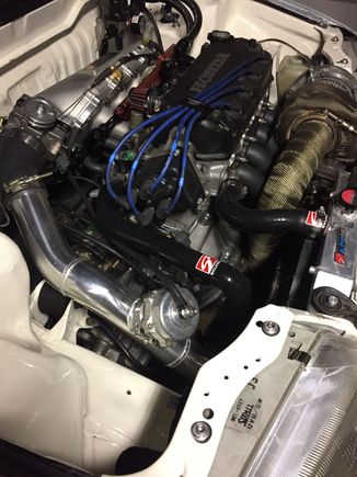 Updated pic of the engine bay. New skunk hoses and the manifolds in. Car runs pretty good so far 