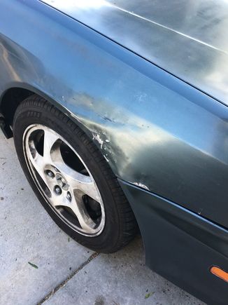Fender after trying to bang it out, after some bondo work and a lot of sanding it could have looked ok but i opted t replace it instead since it needed to be painted anyway.