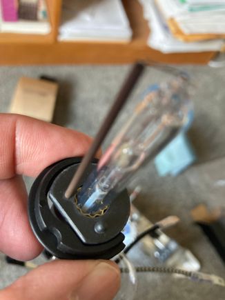 Bulb w/ horseshoe clip. Not the recess that aligns w/ the dimple.