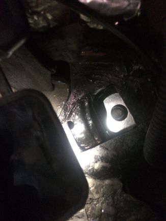 Big washer resting on what remains of the top of that bracket thing the nut was welded on.