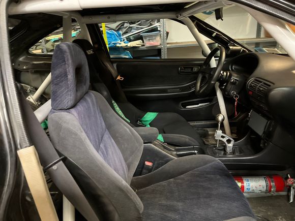 Interior, bolt-in cage, Bride racing seat and K-tuned shifter with Personal wheel. 