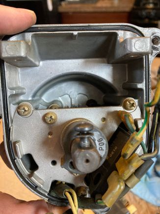 Coil is removed in this picture, ignitor remains in place (lower right of picture).