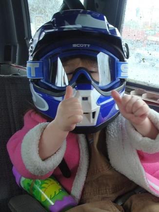My helmet was sitting next to her.  I heard a muffled "Mommy look" from the backseat and saw this.  She was all ready for muddin'.